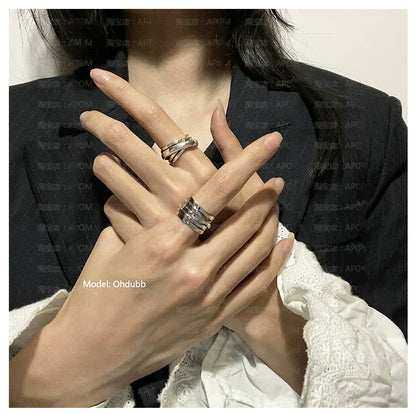 A PART OF ME bandage wrap punk ring stacked on fingers, showcasing a stylish and edgy design
