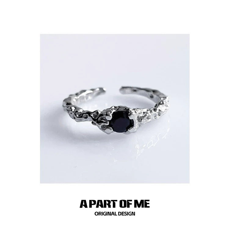 A P ART OF ME silver textured black crown ring featuring a prominent black stone centerpiece