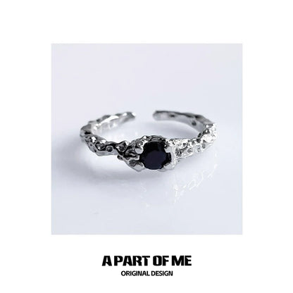 A P ART OF ME silver textured black crown ring featuring a prominent black stone centerpiece