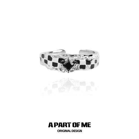 A PART OF ME black white chessboard ring with a unique design and polished finish