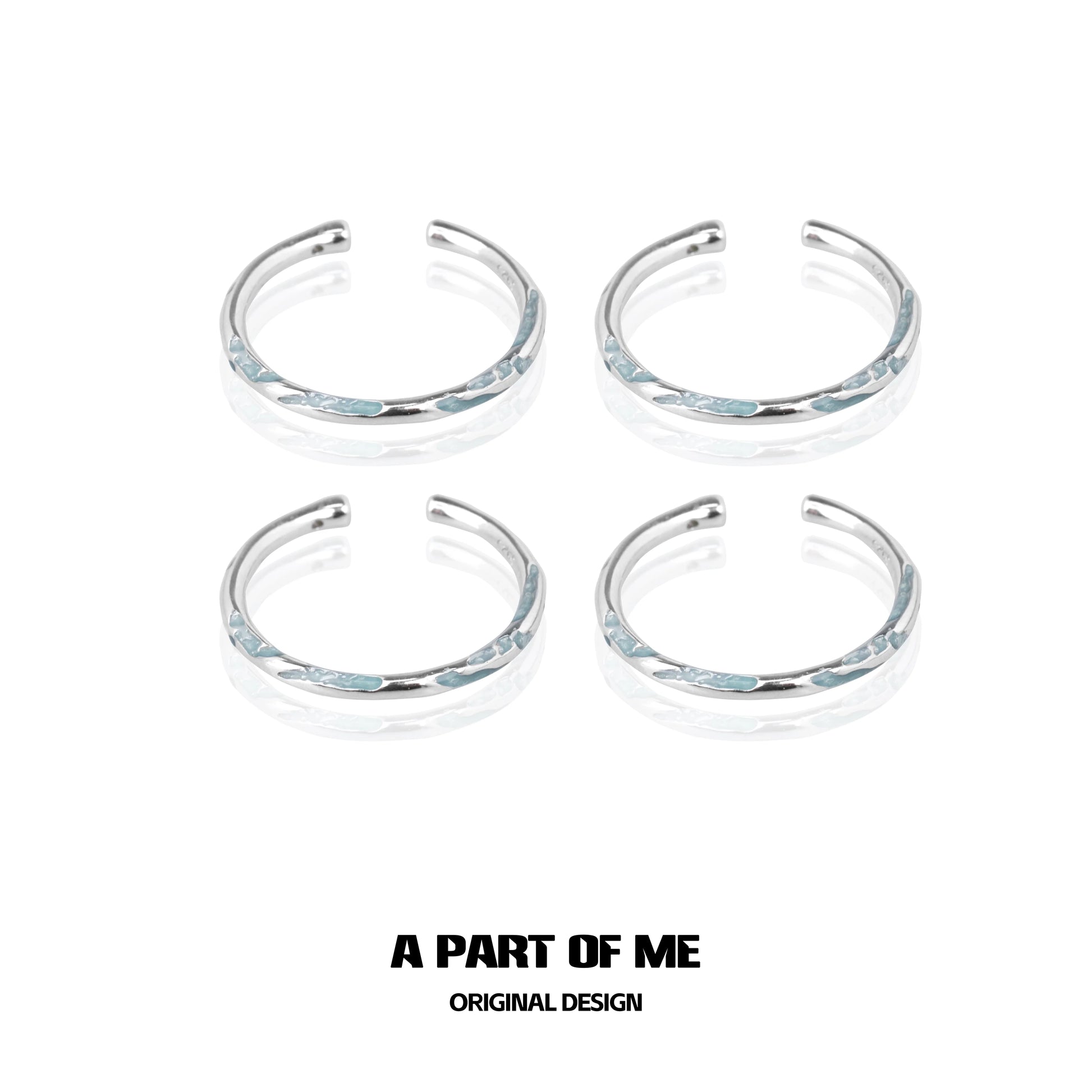 Set of four A PART OF ME blue minimalist rings with sleek silver accents for stylish wear