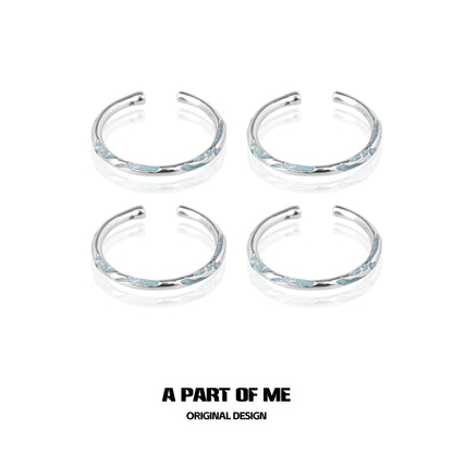 Set of four A PART OF ME blue minimalist rings with sleek silver accents for stylish wear
