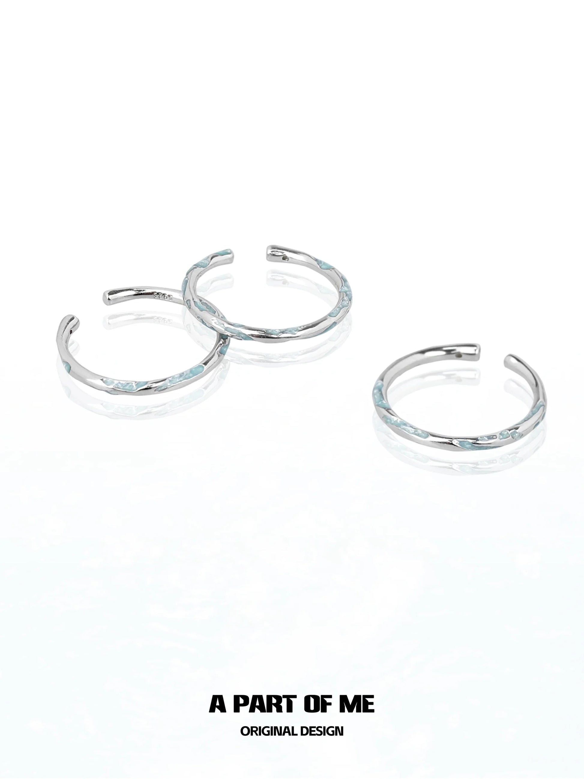 Set of three A PART OF ME blue minimalist ring designs with a sleek silver finish