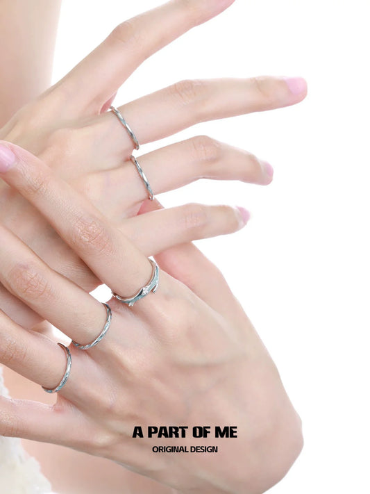 A PART OF ME blue star ring showcased on elegant fingers with other delicate rings