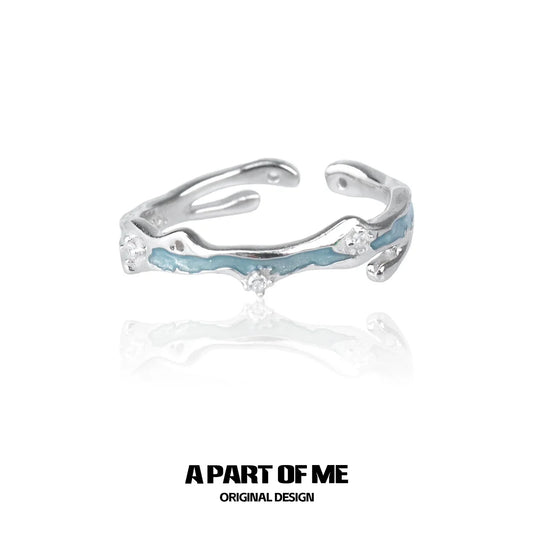 A Part of Me blue star ring featuring a unique design with silver and blue accents
