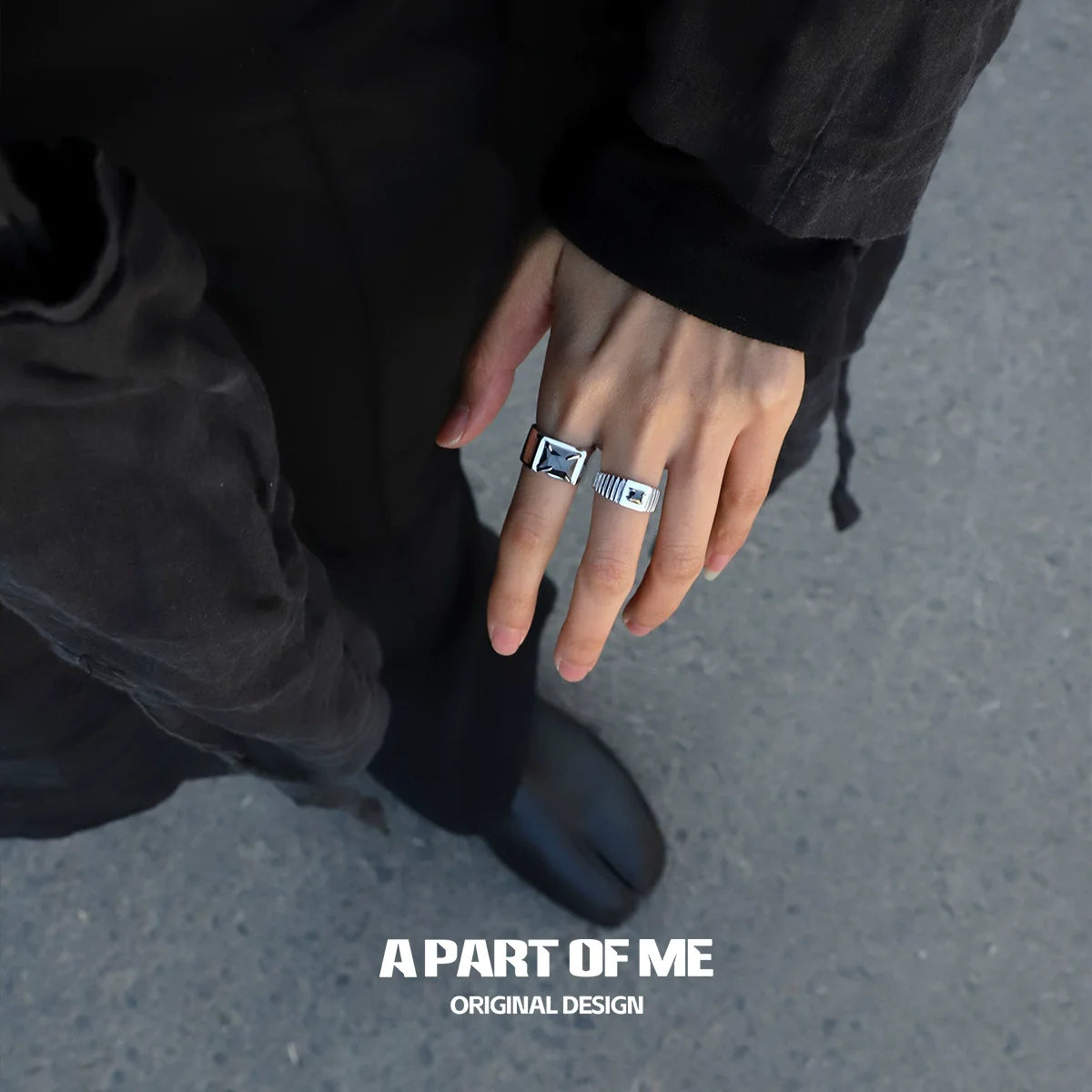 Bold stone hip-hop ring displayed on a person's hand, showcasing its unique design and style.