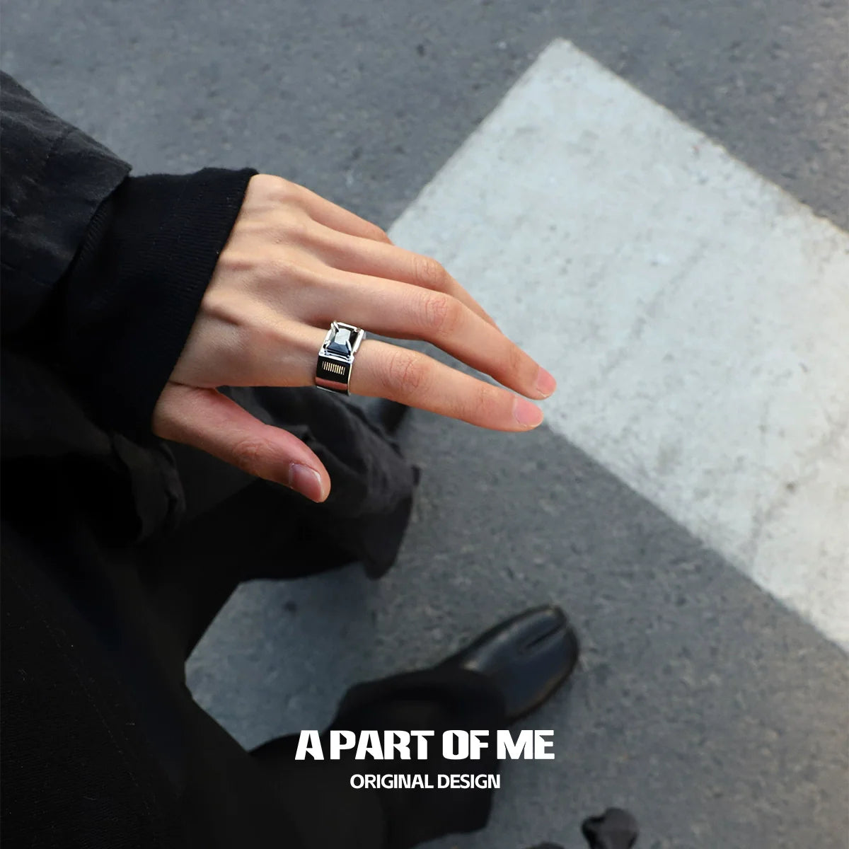 A PART OF ME bold stone hip-hop ring on a hand, showcasing a modern design and stylish appearance