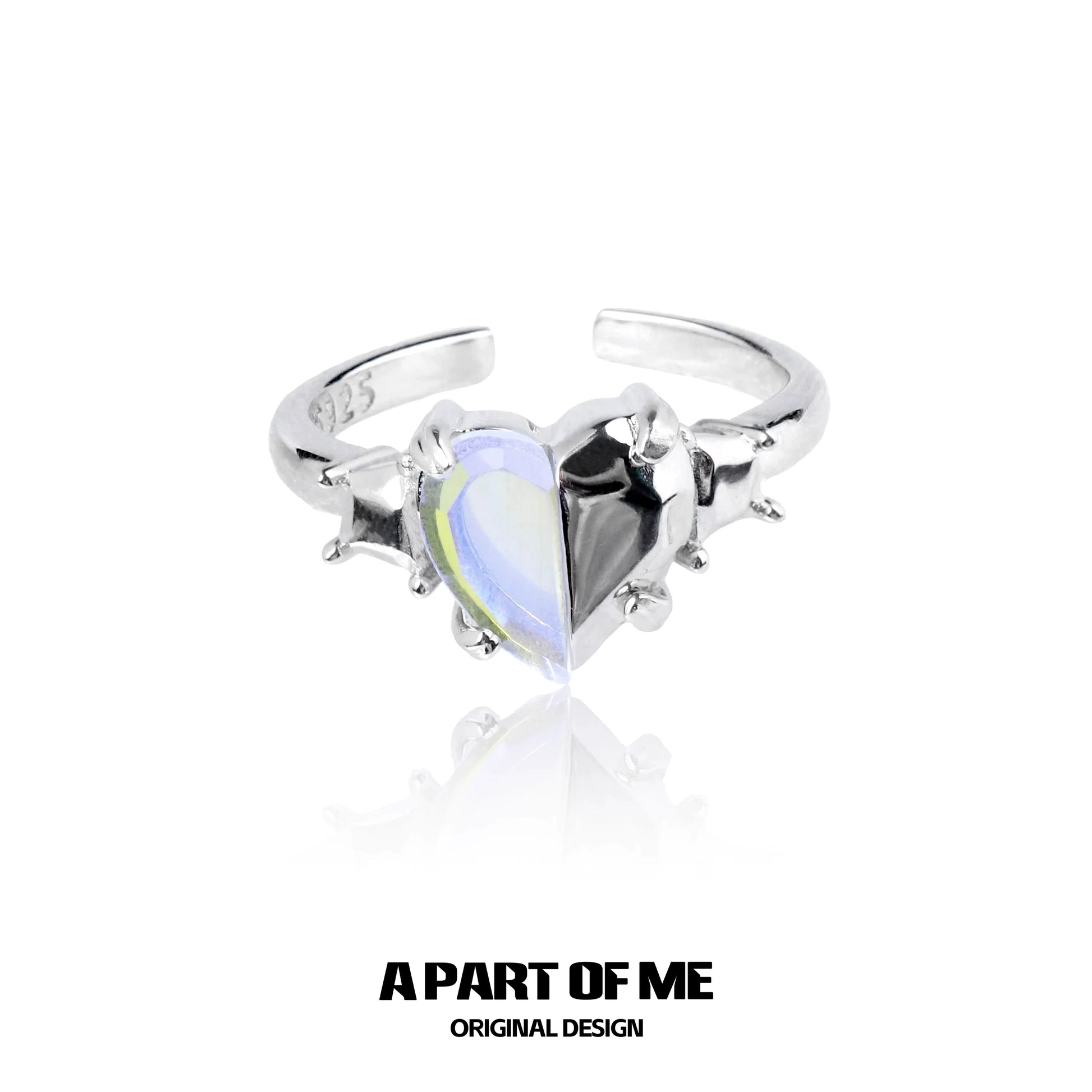 A PART OF ME color changing armor ring featuring a heart-shaped dual color gemstone in a silver setting