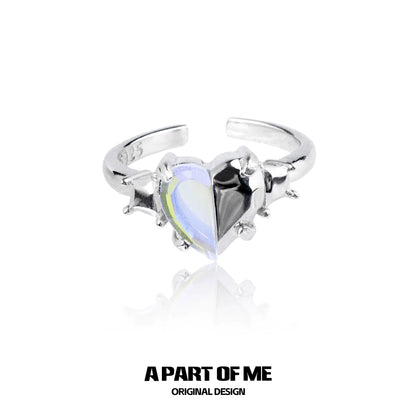 A PART OF ME color changing armor ring featuring a heart-shaped dual color gemstone in a silver setting