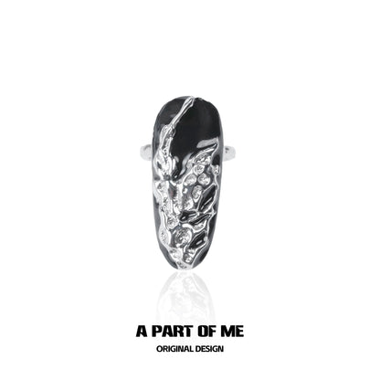 Dark Queen Finger Guard Ring by A PART OF ME featuring a textured black and silver design