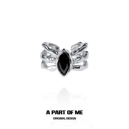 Dark queen finger guard ring featuring a black marquise stone and unique silver design