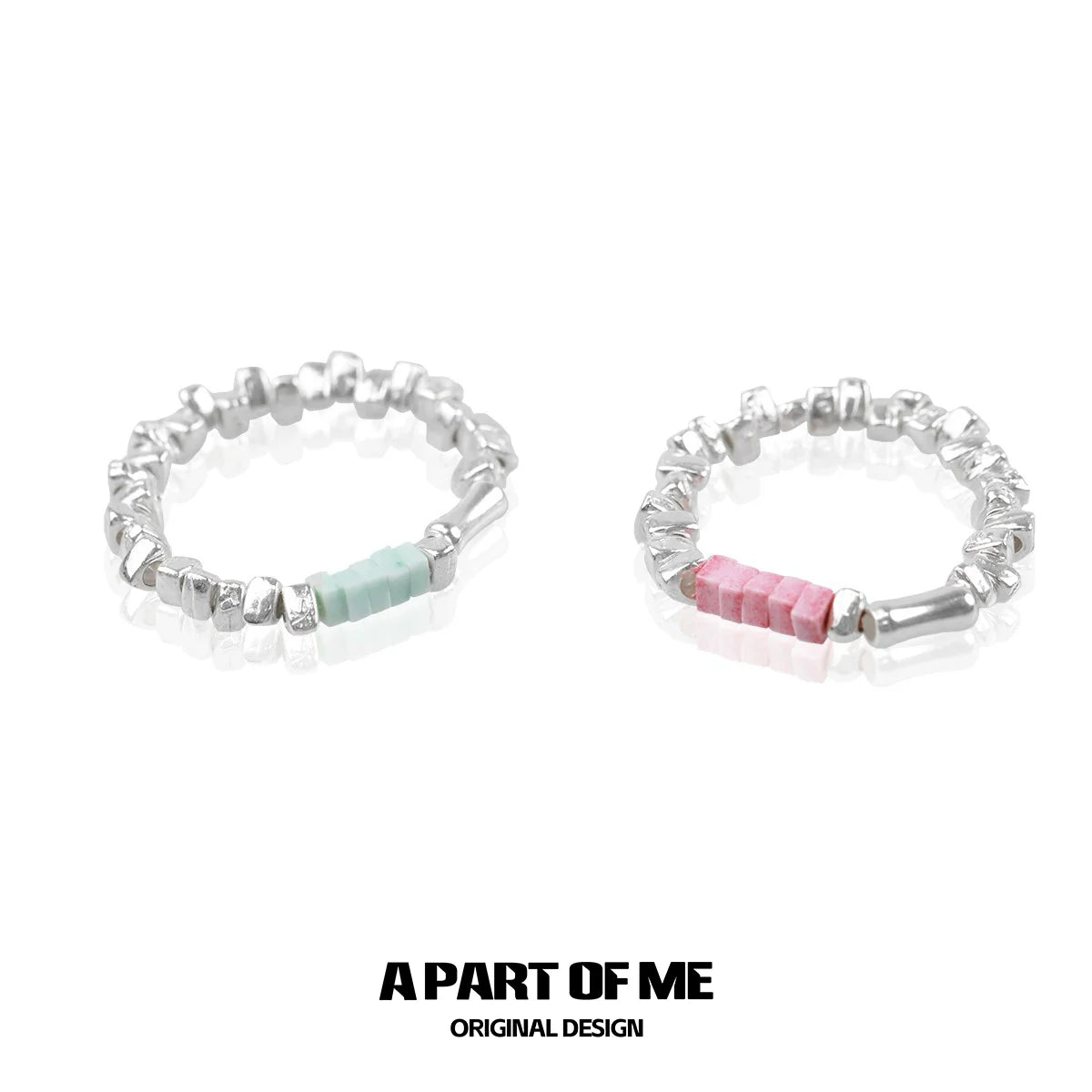 Dopamine ring set featuring silver-tone bands with colorful accents in pink and mint