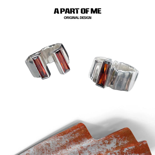 A PART OF ME edgy gothic ring in silver with red gemstone accents for bold style enthusiasts