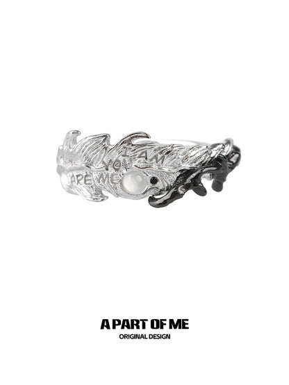 A PART OF ME feather letter ring featuring intricate design and a pearl accent for unique style