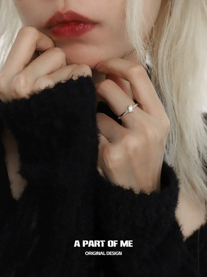 A PART OF ME galaxy star ring on a model's hand with delicate styling and a shimmering star design