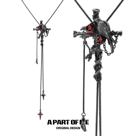 A PART OF ME gothic crow cross necklace with intricate design and red accents, perfect for gothic fashion