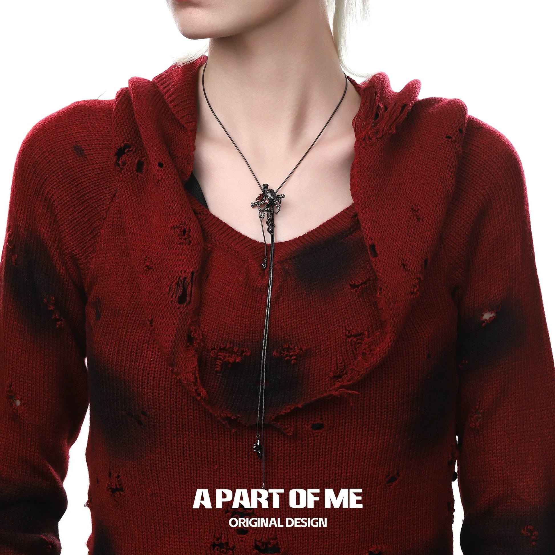 Gothic crow cross necklace displayed on a model wearing a red distressed sweater