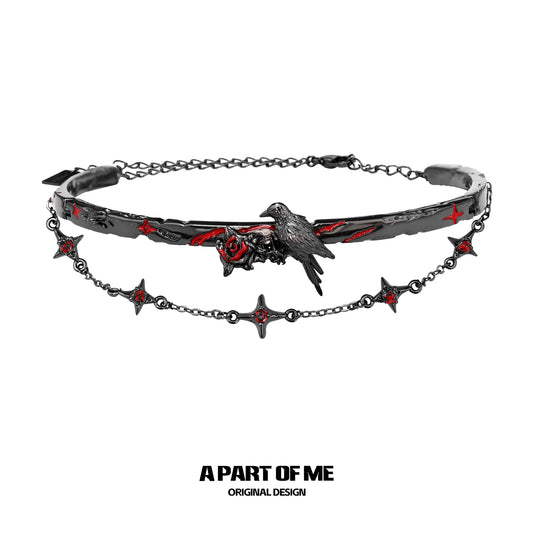 Gothic raven necklace featuring a raven and red accents on a black chain design