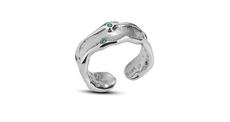 A PART OF ME green crown punk ring featuring a unique twisted design with green gemstones