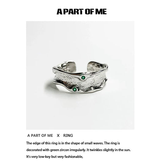 A Part of Me green crown punk ring featuring silver waves and sparkling green zircon accents
