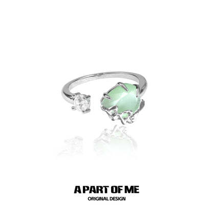Elegant green opal ring with a modern design and sparkling accents