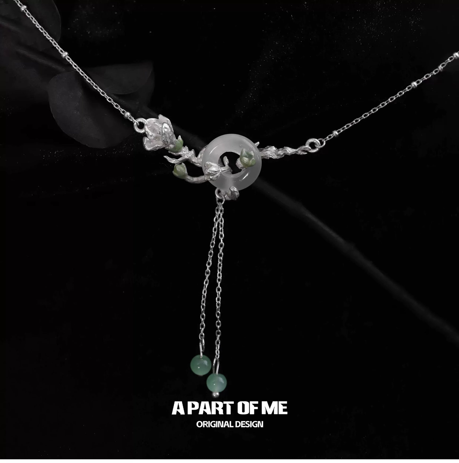 A delicate jasmine silver necklace featuring floral designs and adjustable chains for elegant styling