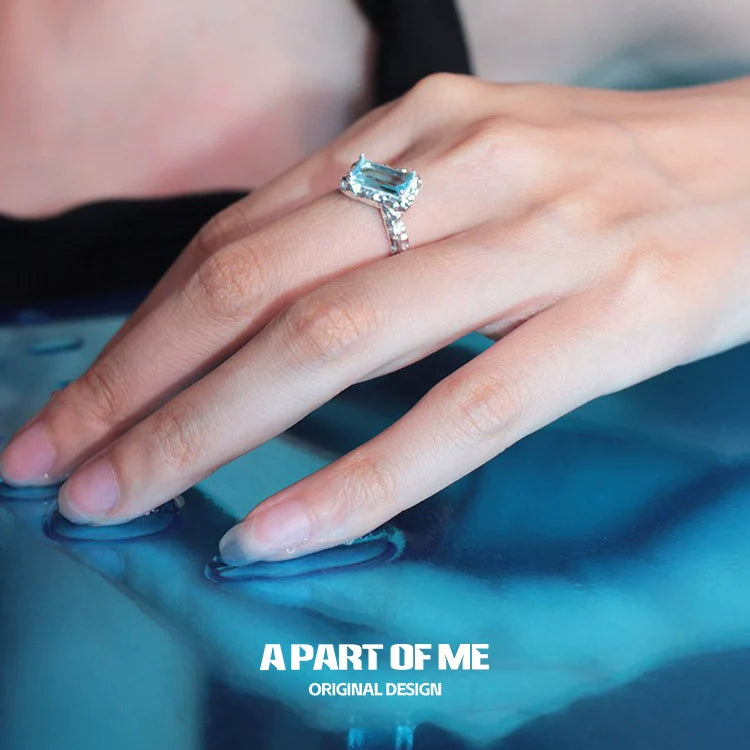 Elegant A PART OF ME mermaid tears silver ring with a large blue gemstone on a delicate band