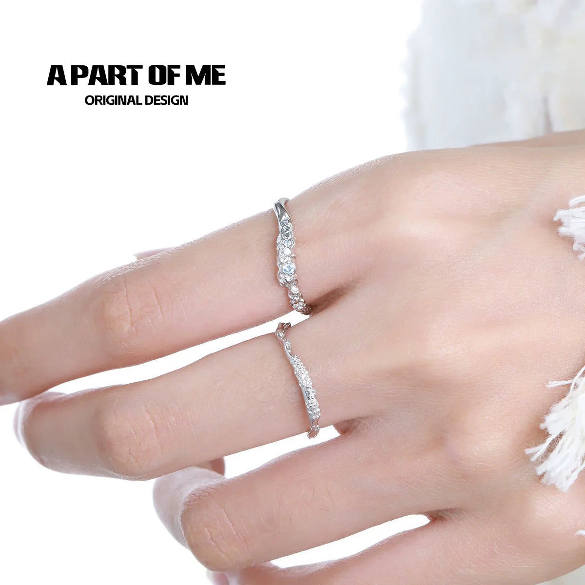 A PART OF ME minimalist lunar texture ring showcased on a hand with a delicate jewelry design