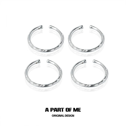 Set of four A PART OF ME minimalist stack rings in silver with delicate details