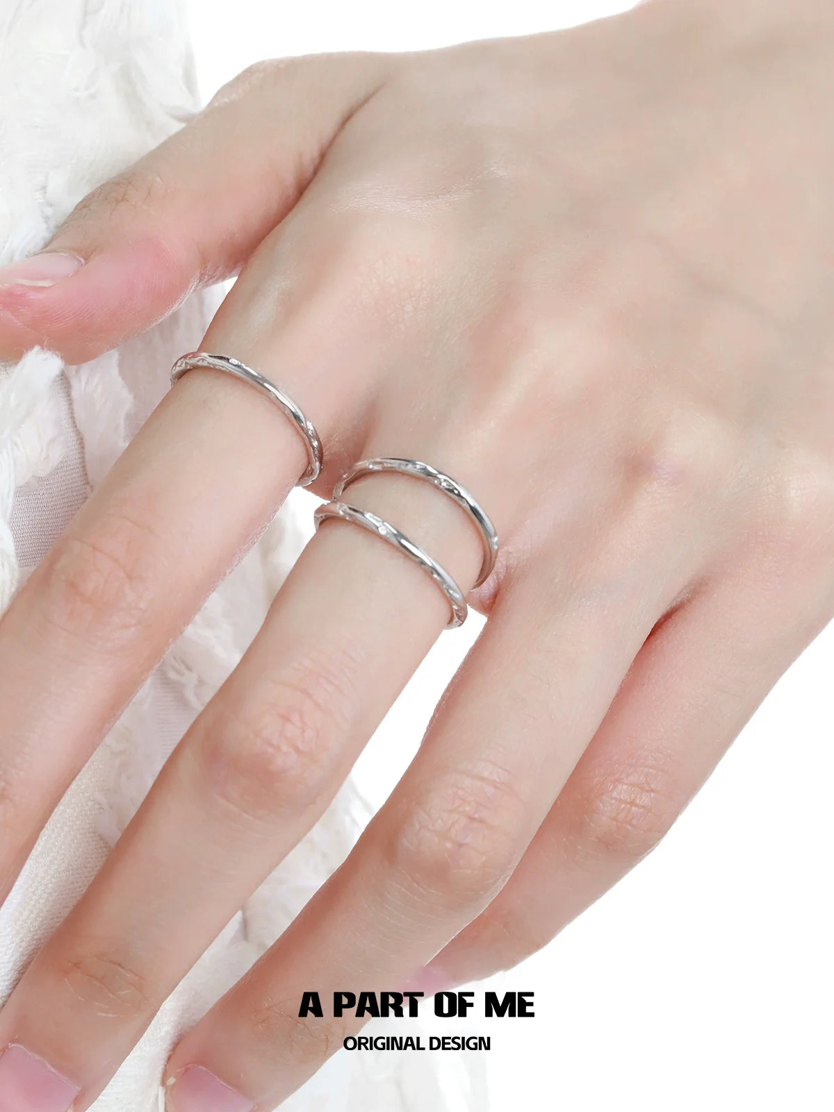 Silver Minimalist Stack Rings on a Hand for Elegant and Simple Jewelry Style