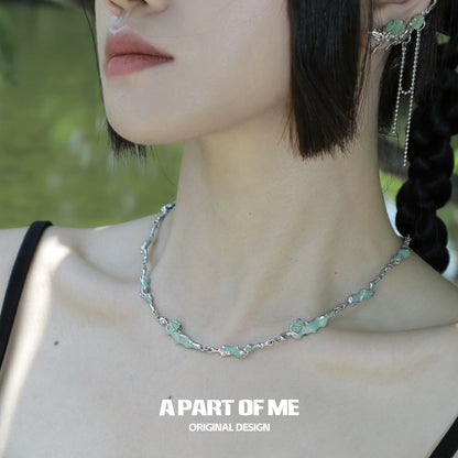 A PART OF ME opal anchor necklace featuring a silver chain and delicate opal accents