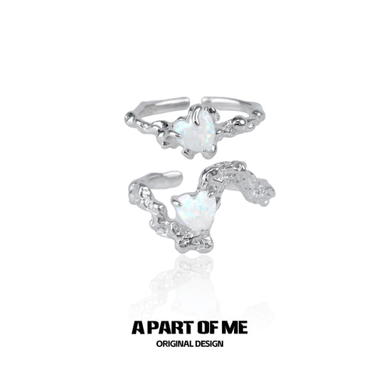 A PART OF ME opal heart ring with a unique silver design and shimmering opal centerpiece