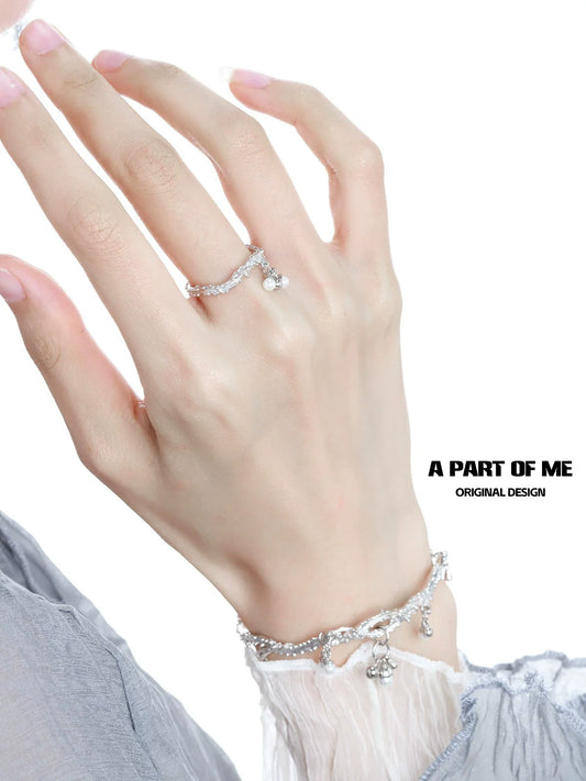 Elegant pearl elf silver ring displayed on a hand, showcasing unique design and shimmer