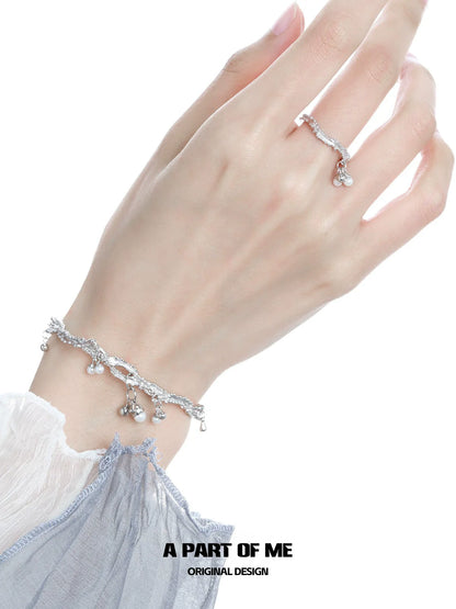 A PART OF ME pearl elf silver ring showcased on a hand with a matching bracelet