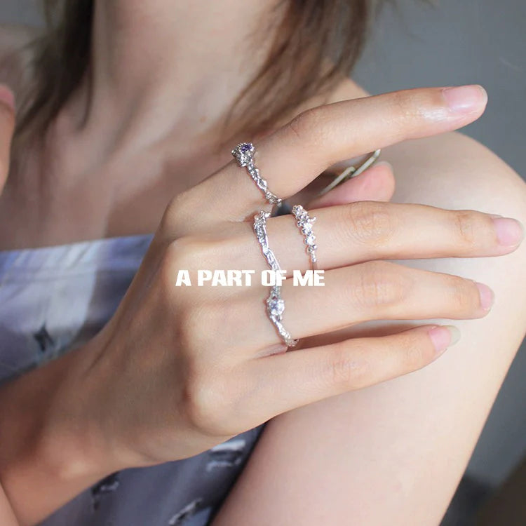 A PART OF ME Purple Zircon Wave Ring on a model's hand showcasing its elegant design