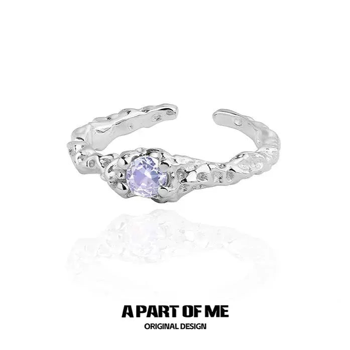 A PART OF ME silver purple zircon wave ring with a unique textured design