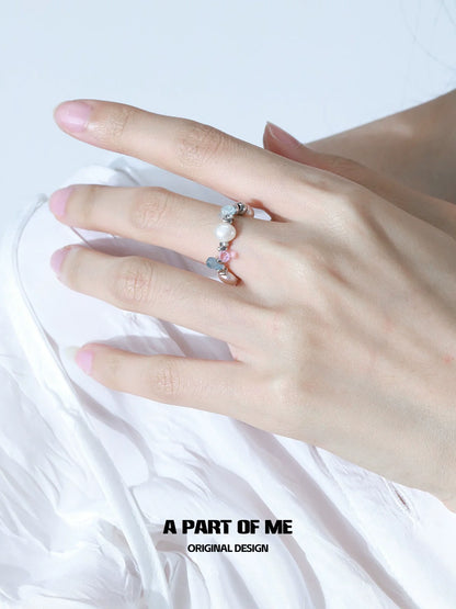 A Part of Me rainbow pearl ring featuring colorful pearls on a delicate band for elegant style