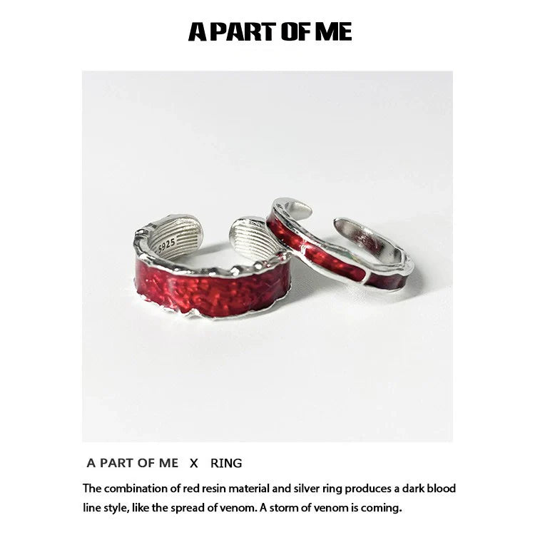 A PART OF ME red venom couple rings featuring red resin and silver accents in a striking design