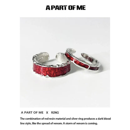 A PART OF ME red venom couple rings featuring red resin and silver accents in a striking design