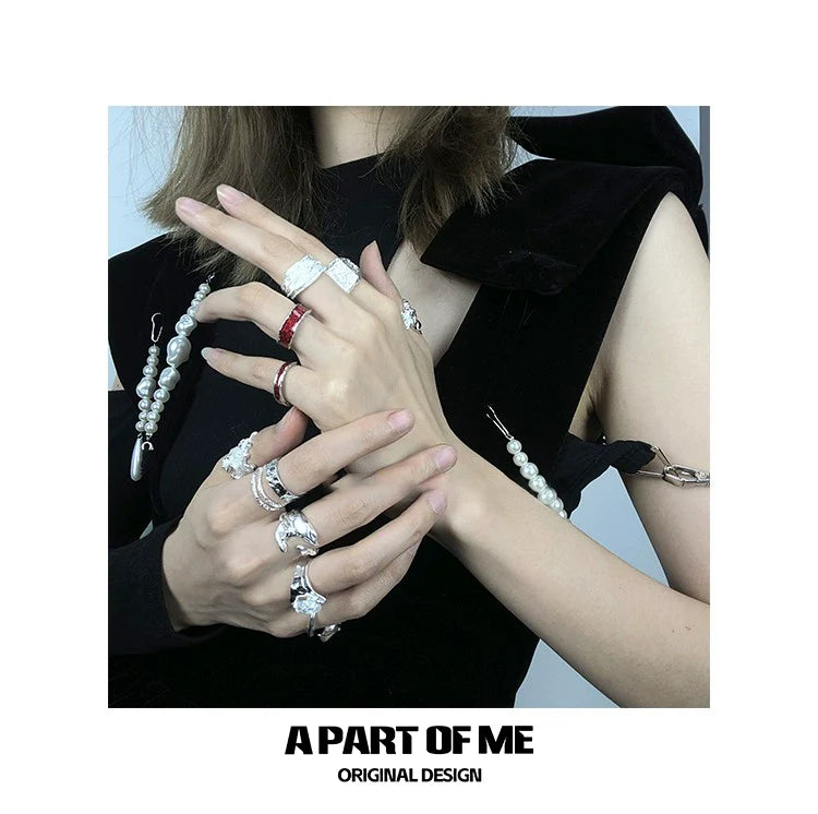 Fashionable A PART OF ME red venom couple rings showcased on stylish hands with elegant accessories