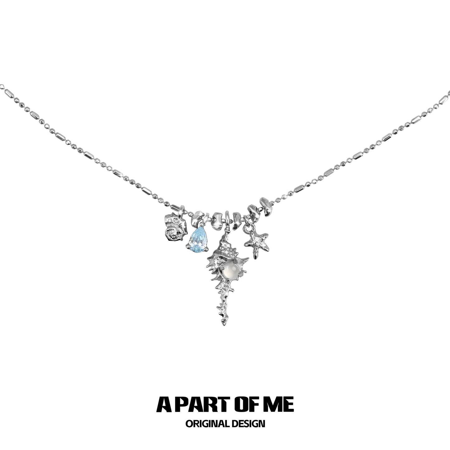 A PART OF ME sea whisper agate necklace featuring sea-themed charms and a delicate chain