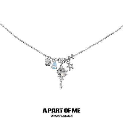 A PART OF ME sea whisper agate necklace featuring sea-themed charms and a delicate chain
