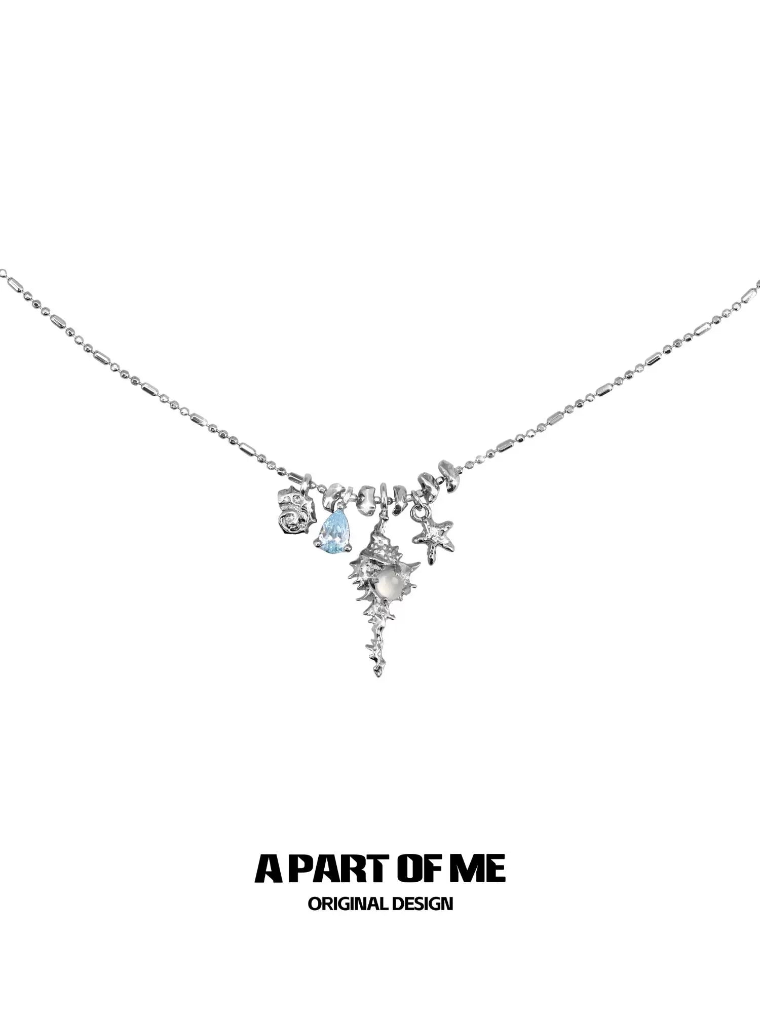 A Part of Me sea whisper agate necklace featuring elegant charms and a delicate silver chain