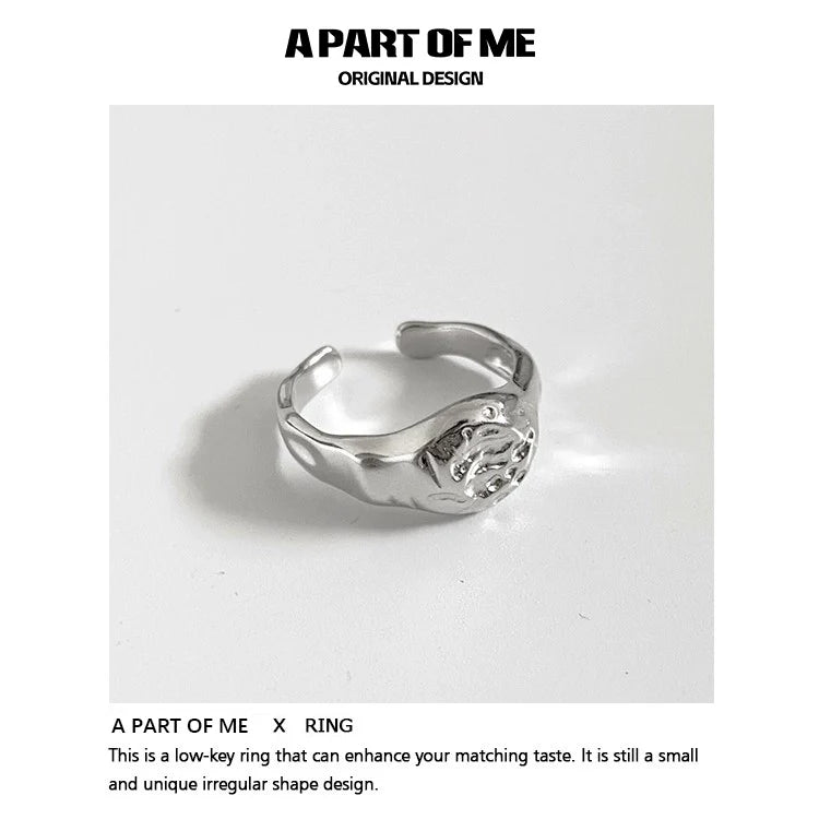 A unique silver A PART OF ME self-love ring for women with an irregular shape design