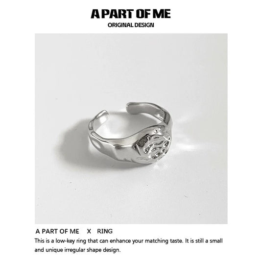 A unique silver A PART OF ME self-love ring for women with an irregular shape design
