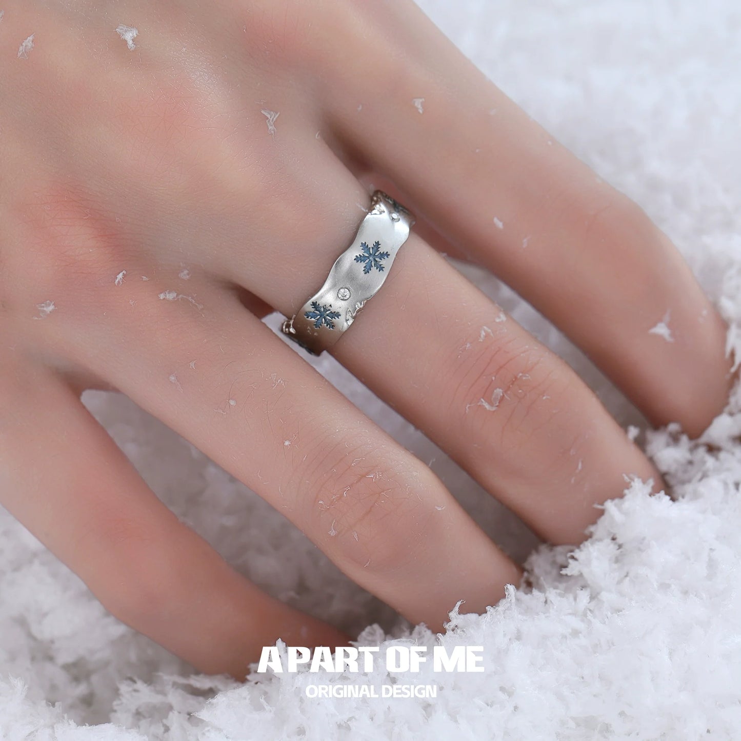 Silver snowflake love ring with delicate design, perfect for winter fashion and gifts