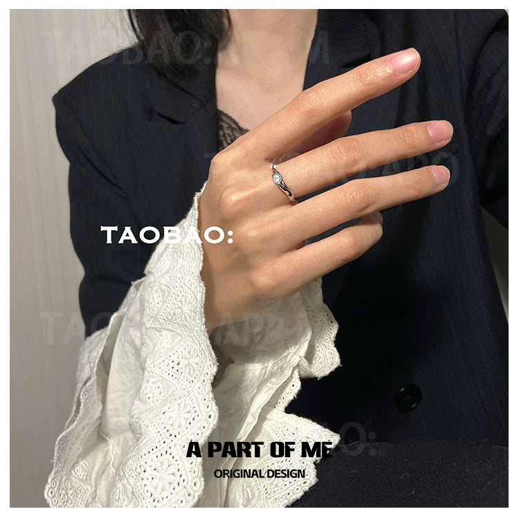 Elegant hand wearing a starry dream romantic ring, showcasing its delicate design and sparkle