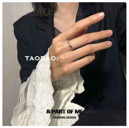 Elegant hand wearing a starry dream romantic ring, showcasing its delicate design and sparkle