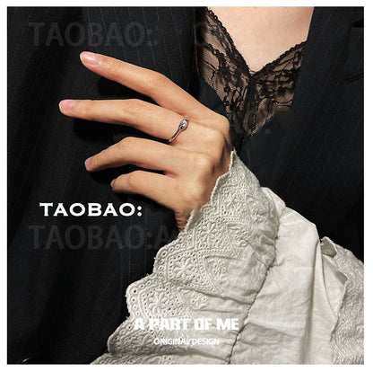 Elegant hand wearing a starry dream romantic ring, showcasing its delicate design