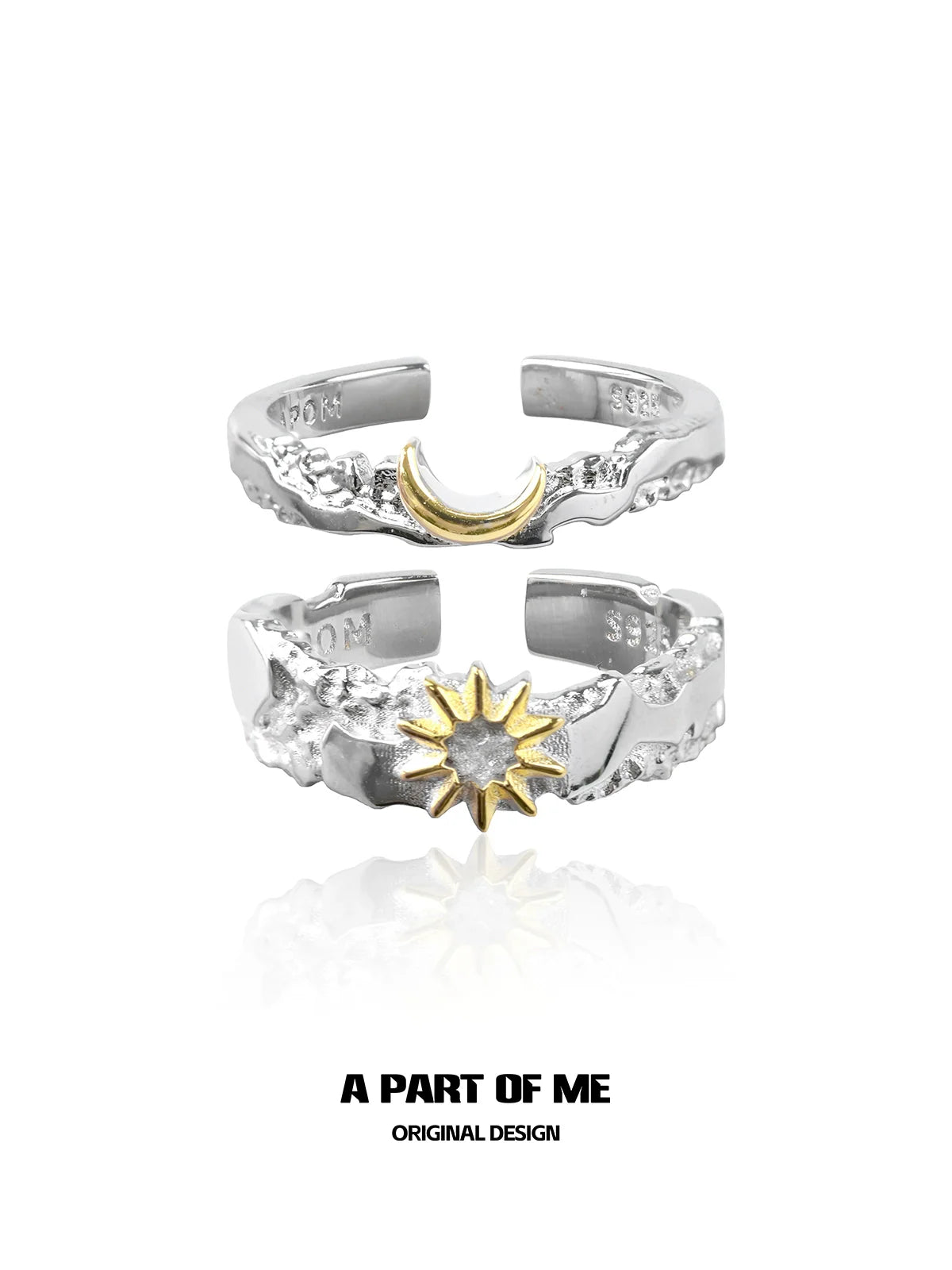 Silver sun and moon couple rings featuring a gold crescent moon and a gold sun design